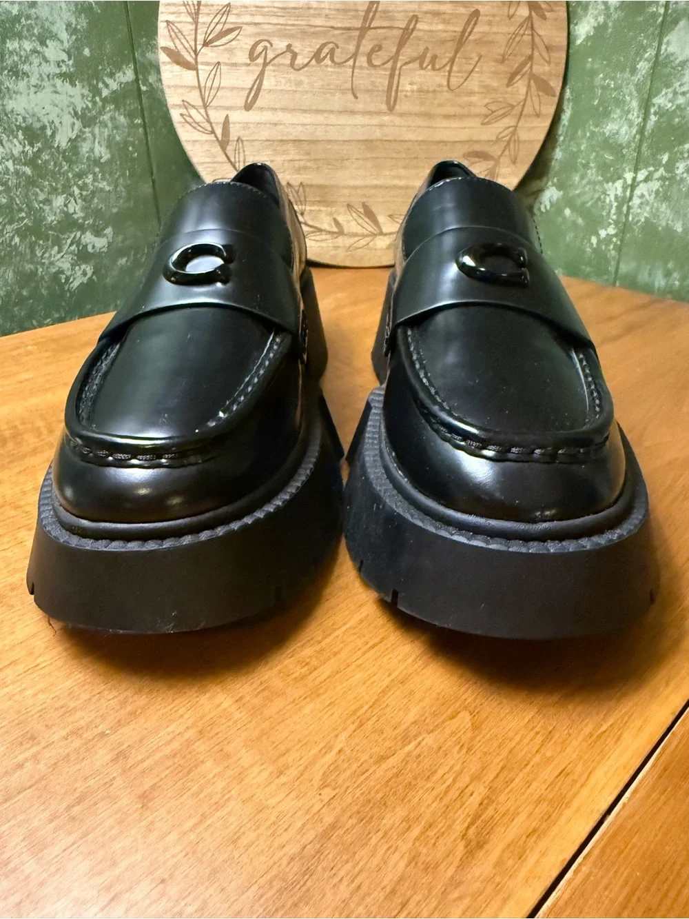 Coach polished black